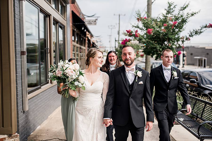 bridal party walking down the sidewalk by associate photographer