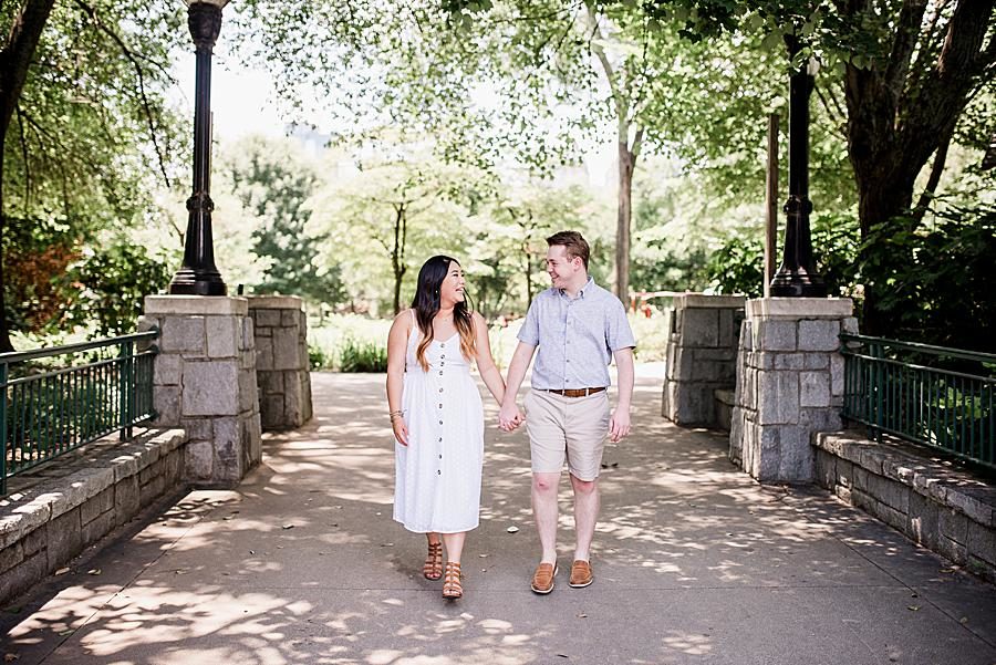 Holding hands at this Piedmont Park Proposal by Knoxville Wedding Photographer, Amanda May Photos.