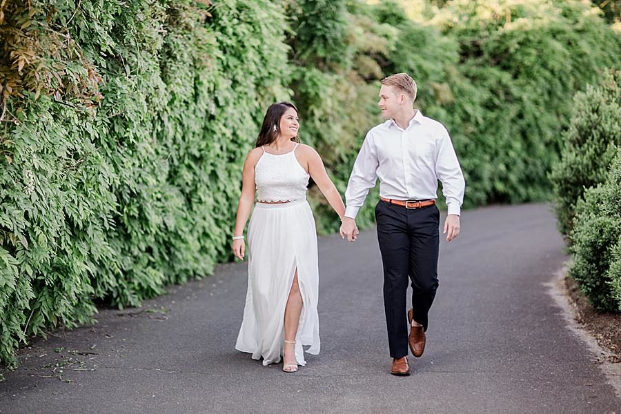 Holding hands at this Baxter Gardens Portraits by Knoxville Wedding Photographer, Amanda May Photos.