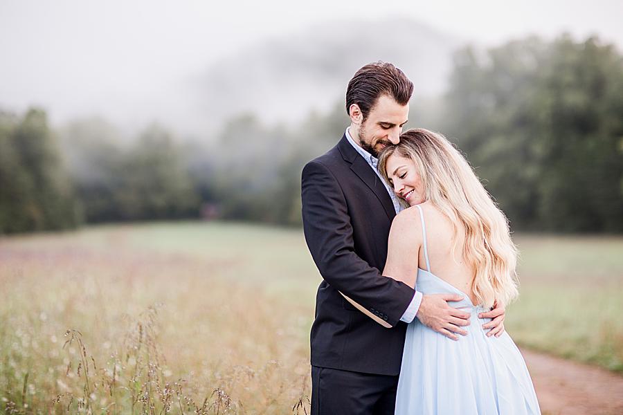 head on chest at cades cove engagement session