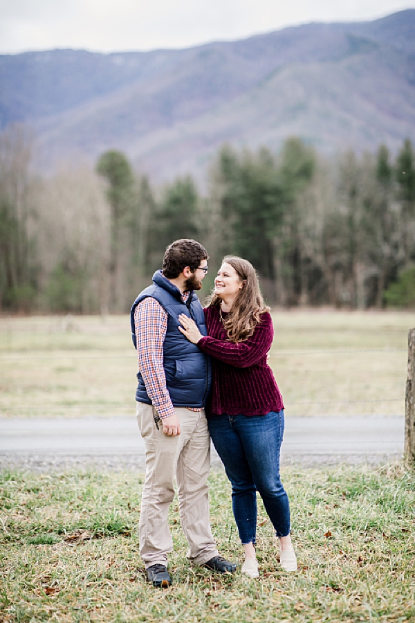couple looking at each other at cades cove proposal
