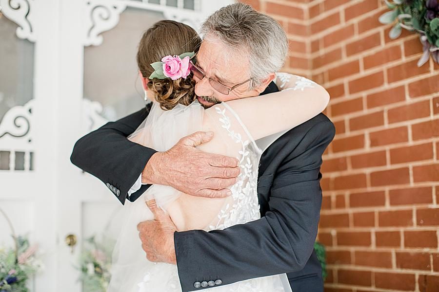 Hugging dad at this Cardwell Manor Wedding by Knoxville Wedding Photographer, Amanda May Photos.