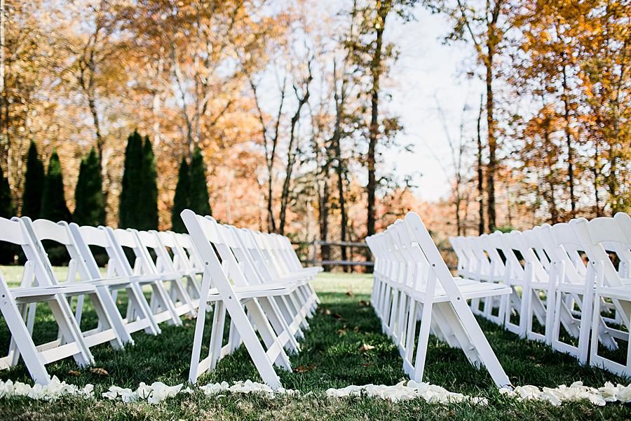 White folding chairs at this Wedding at Castleton Farms by Knoxville Wedding Photographer, Amanda May Photos.