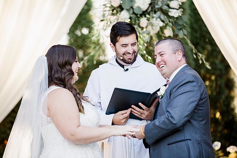 Exchanging rings at this Wedding at Castleton Farms by Knoxville Wedding Photographer, Amanda May Photos.