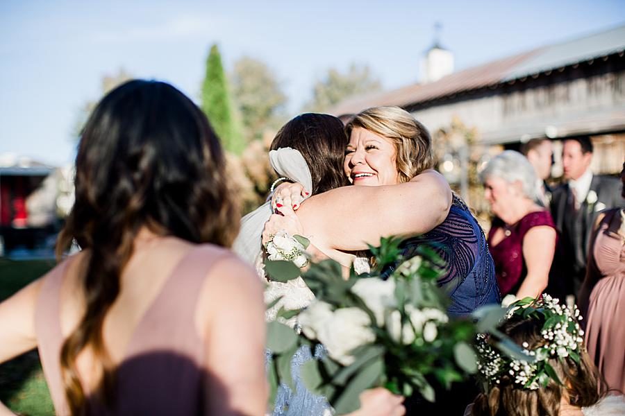 Hugging mom at this Wedding at Castleton Farms by Knoxville Wedding Photographer, Amanda May Photos.