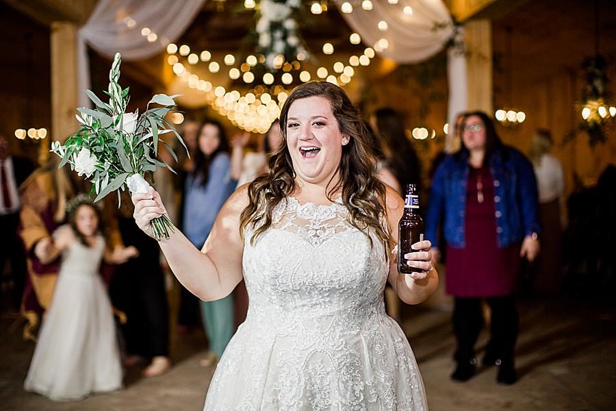 Bouquet toss by Knoxville Wedding Photographer, Amanda May Photos.