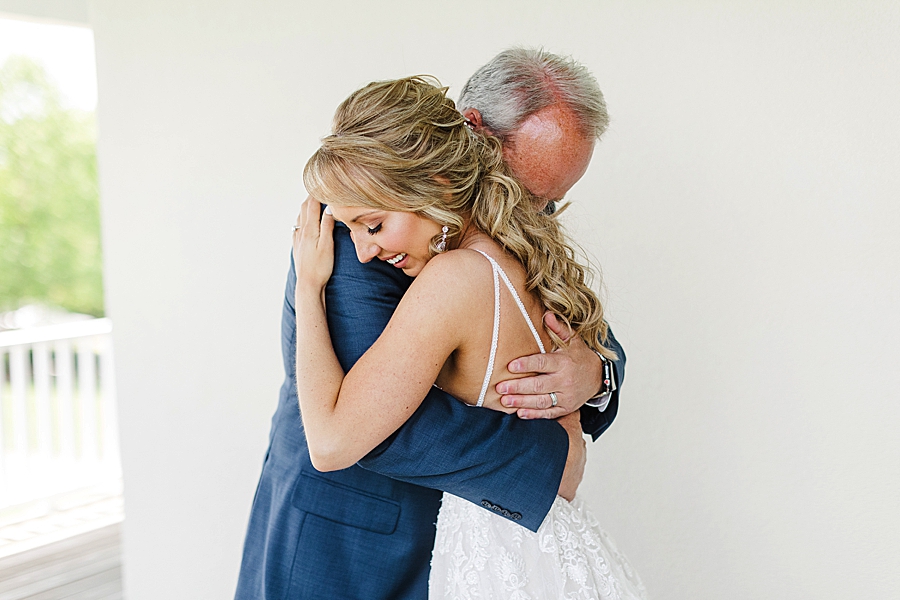 Bride hugging dad 