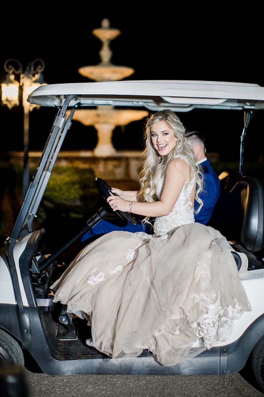 Bride driving golfcart