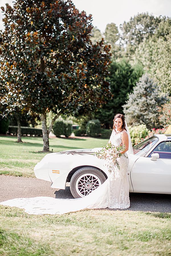 Bride in front of vintage car at castleton vow renewal