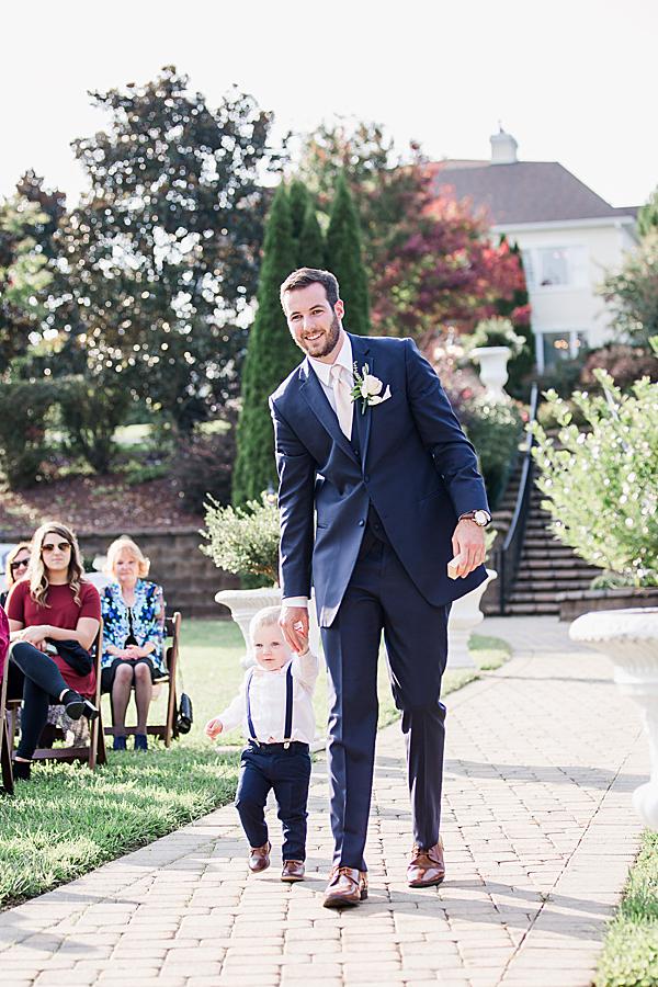 Groom walking down the aisle at castleton vow renewal