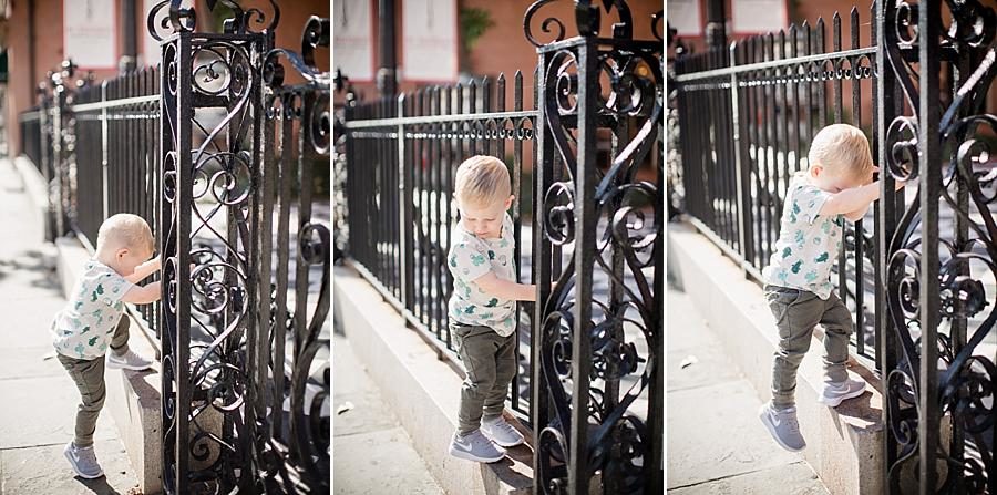 Holding the fence at this Charleston Session by Knoxville Wedding Photographer, Amanda May Photos.