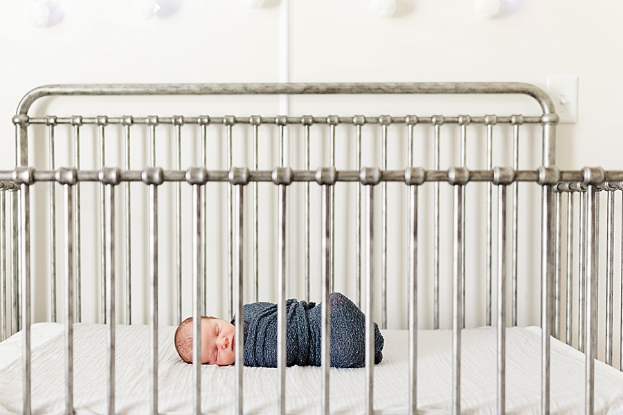 baby in crib cleveland newborn session