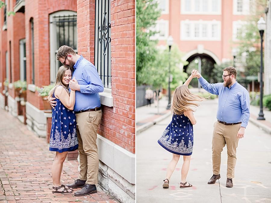 Twirling at this downtown engagement by Knoxville Wedding Photographer, Amanda May Photos.