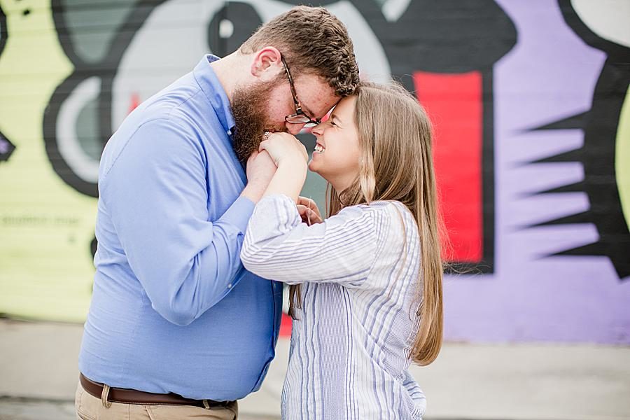 Hand kiss at this downtown engagement by Knoxville Wedding Photographer, Amanda May Photos.