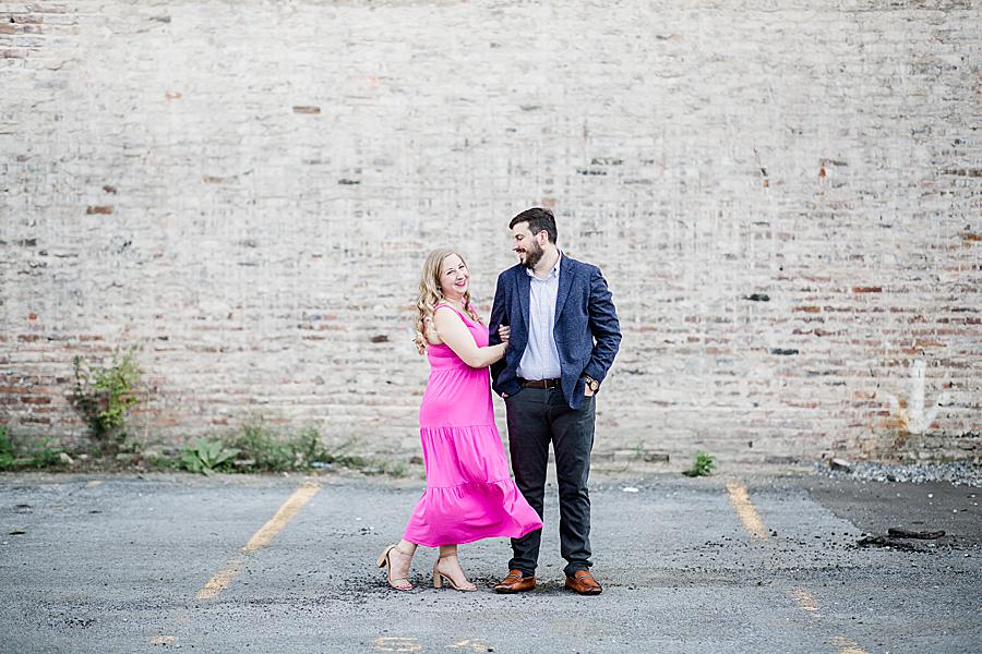 couple in fron tof brick wall at downtown urban engagement