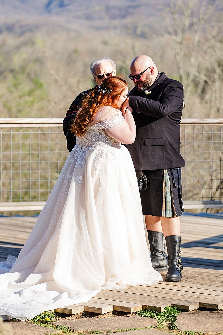 kiss on the hand at dreammore resort wedding