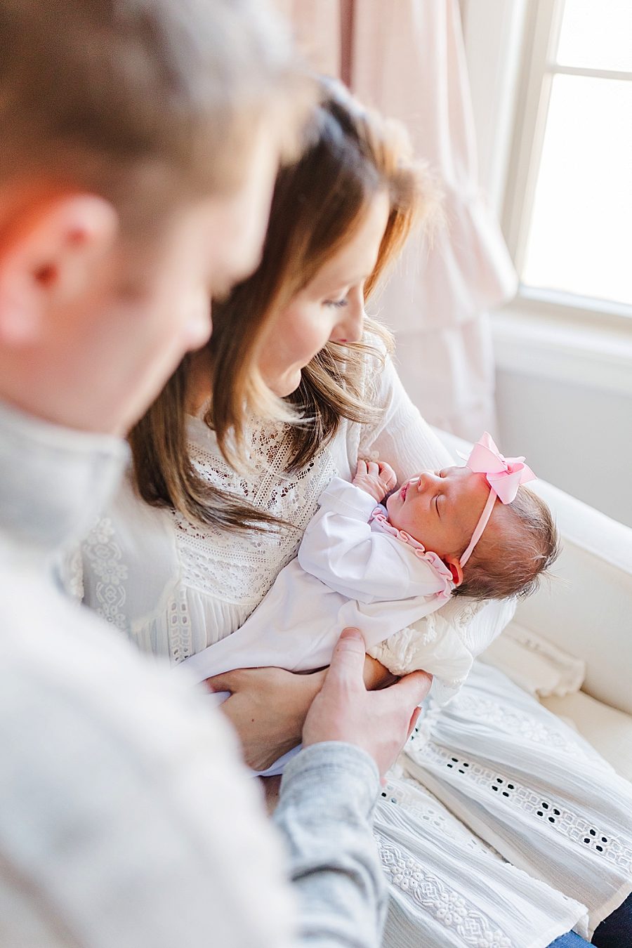 holding baby girl dreamy newborn session