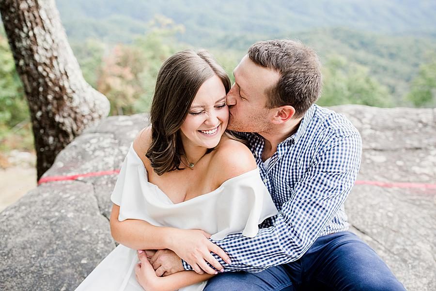 Kiss on cheek at this Eagle Rock engagement by Knoxville Wedding Photographer, Amanda May Photos.