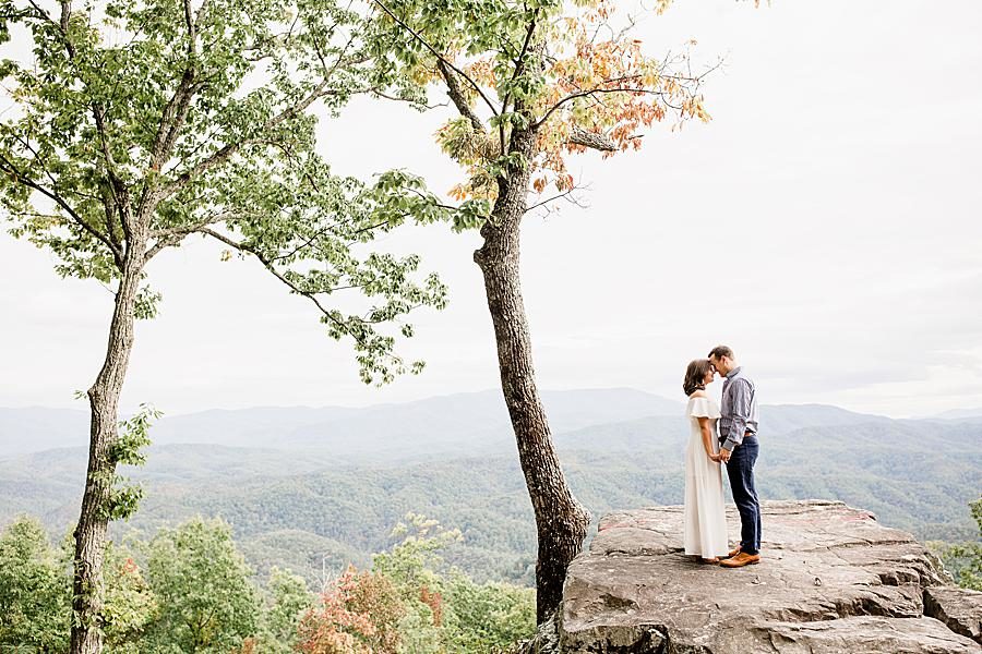 On a rock at this Eagle Rock engagement by Knoxville Wedding Photographer, Amanda May Photos.