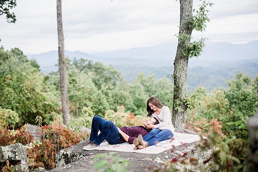 Laying on a blanket at this Eagle Rock engagement by Knoxville Wedding Photographer, Amanda May Photos.