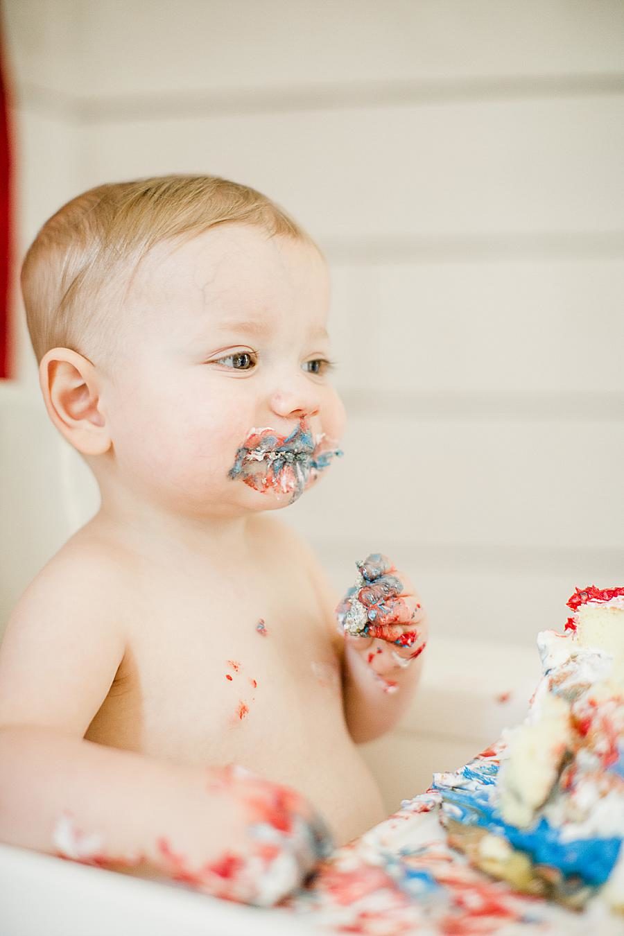 baby covered in smash cake at fountain city 1