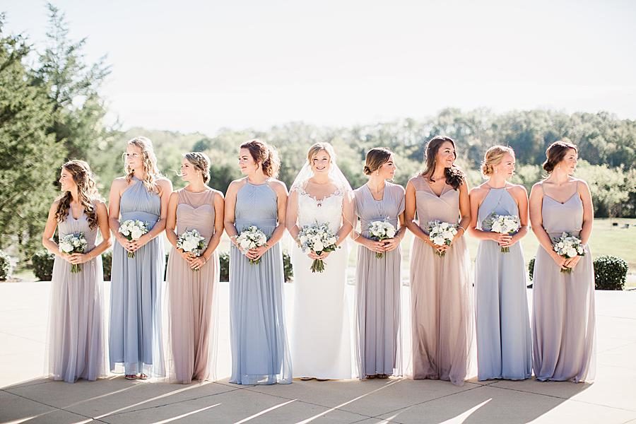 Blue and champagne dresses at this Graystone Quarry wedding by Knoxville Wedding Photographer, Amanda May Photos.