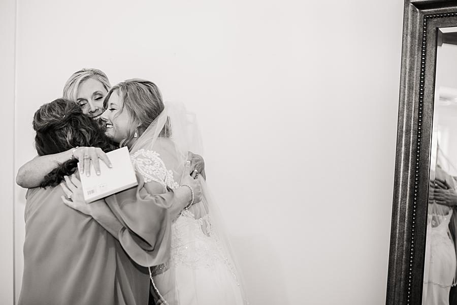 Hugging at this Graystone Quarry wedding by Knoxville Wedding Photographer, Amanda May Photos.