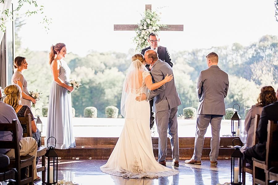 Kiss on the cheek at this Graystone Quarry wedding by Knoxville Wedding Photographer, Amanda May Photos.
