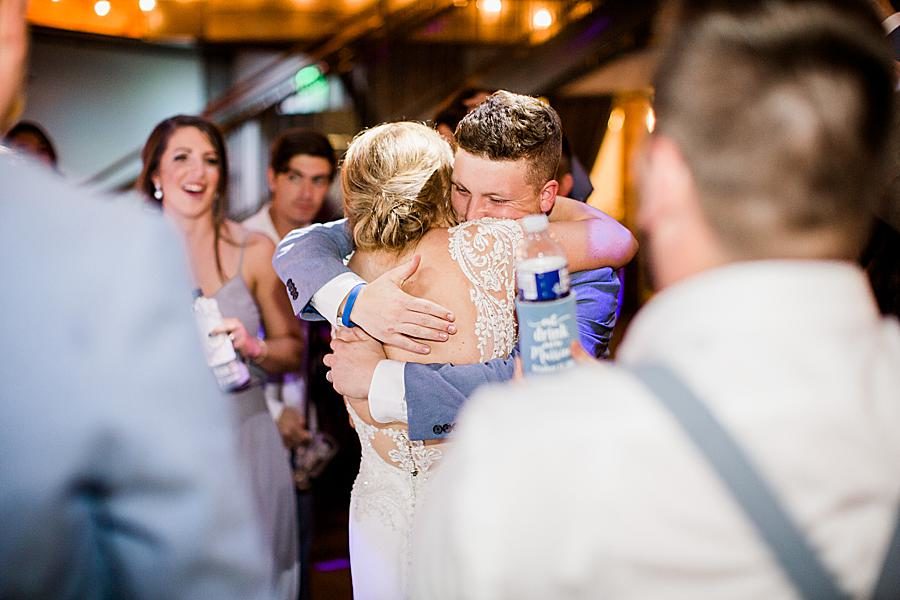 Bride and groom hugs by Knoxville Wedding Photographer, Amanda May Photos.