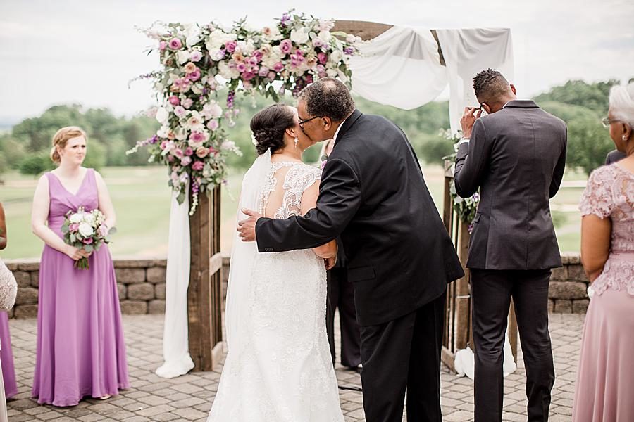 Kiss on the cheek at this Holston Hills Country Club wedding by Knoxville Wedding Photographer, Amanda May Photos.