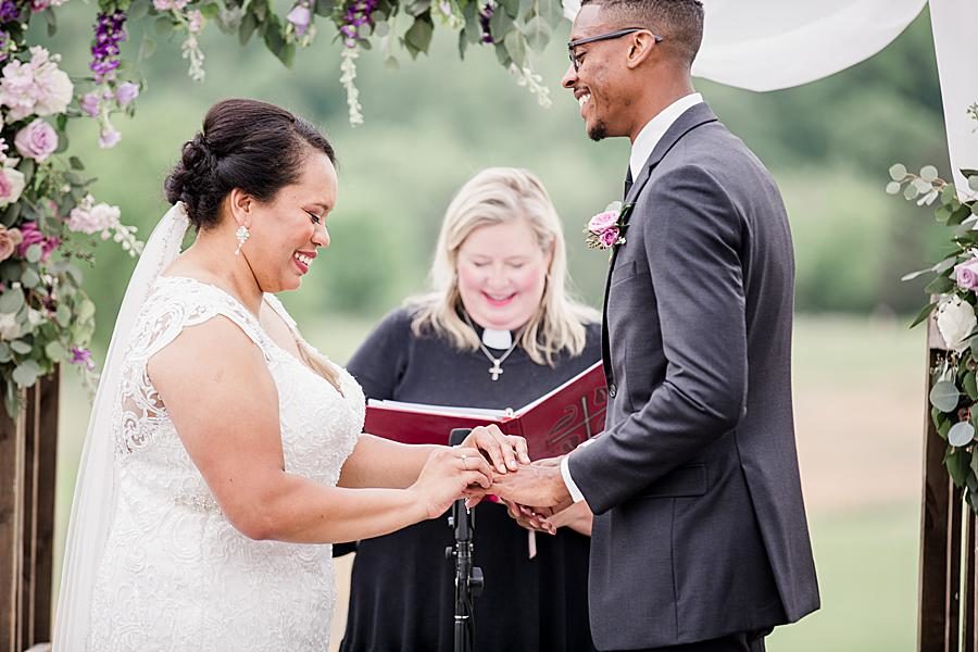 Exchanging rings at this Holston Hills Country Club wedding by Knoxville Wedding Photographer, Amanda May Photos.