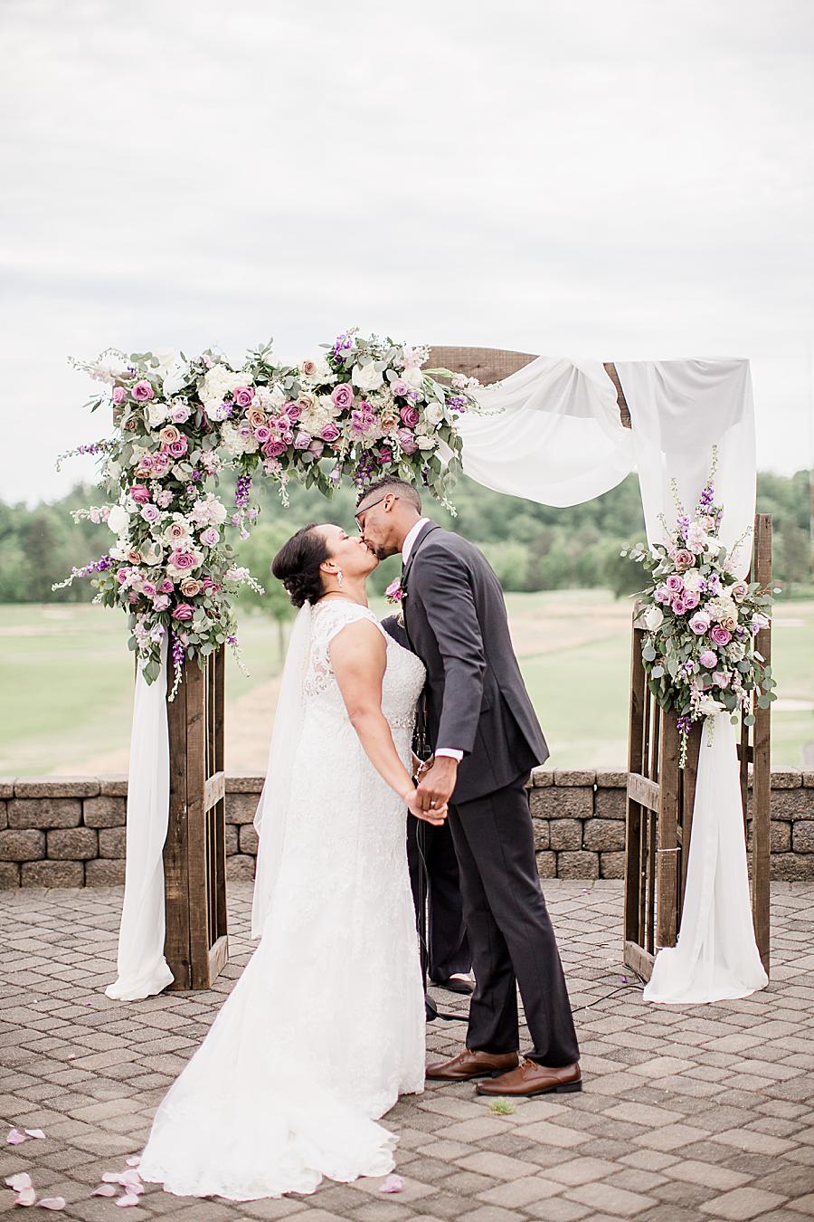 Kiss the bride at this Holston Hills Country Club wedding by Knoxville Wedding Photographer, Amanda May Photos.