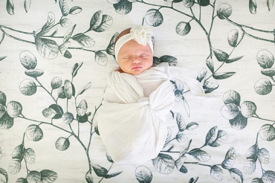 baby on eucalyptus sheets at home newborn