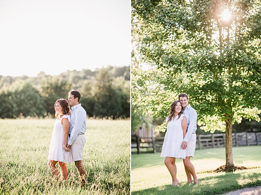 couple in field at hunter valley farm engagement