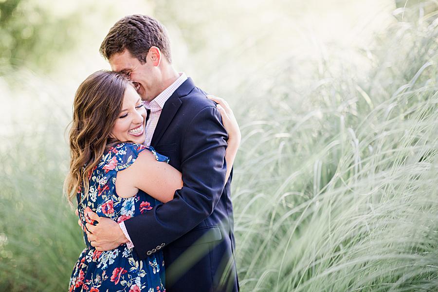 couple standing in decorative grass at hunter valley farm engagement