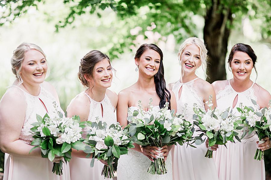 bridal party holding bouquets at hunter valley farm wedding