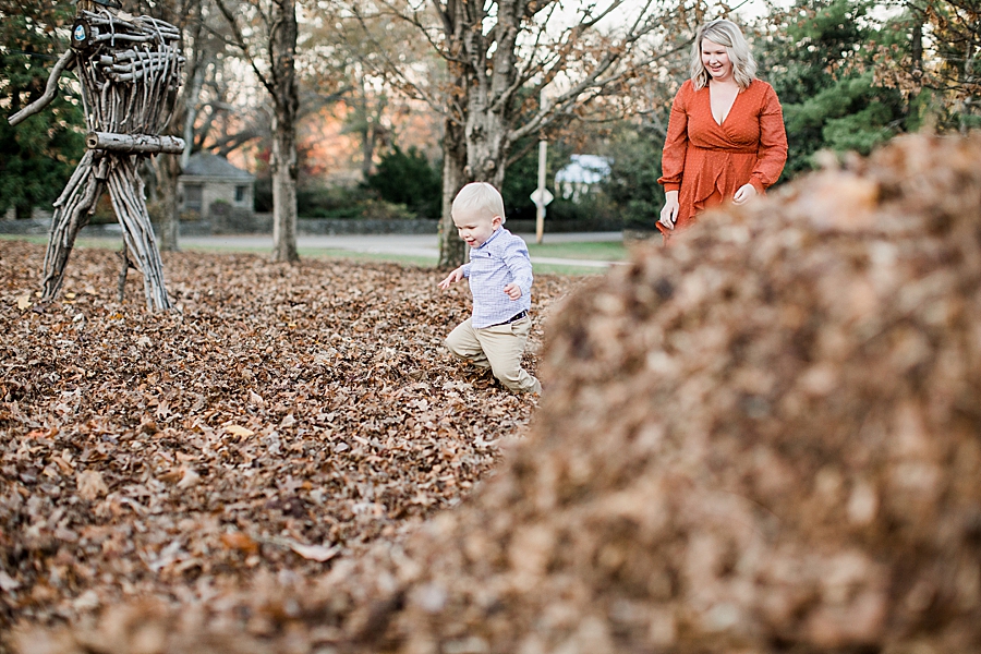 playing in leaves at knox botanical fall family