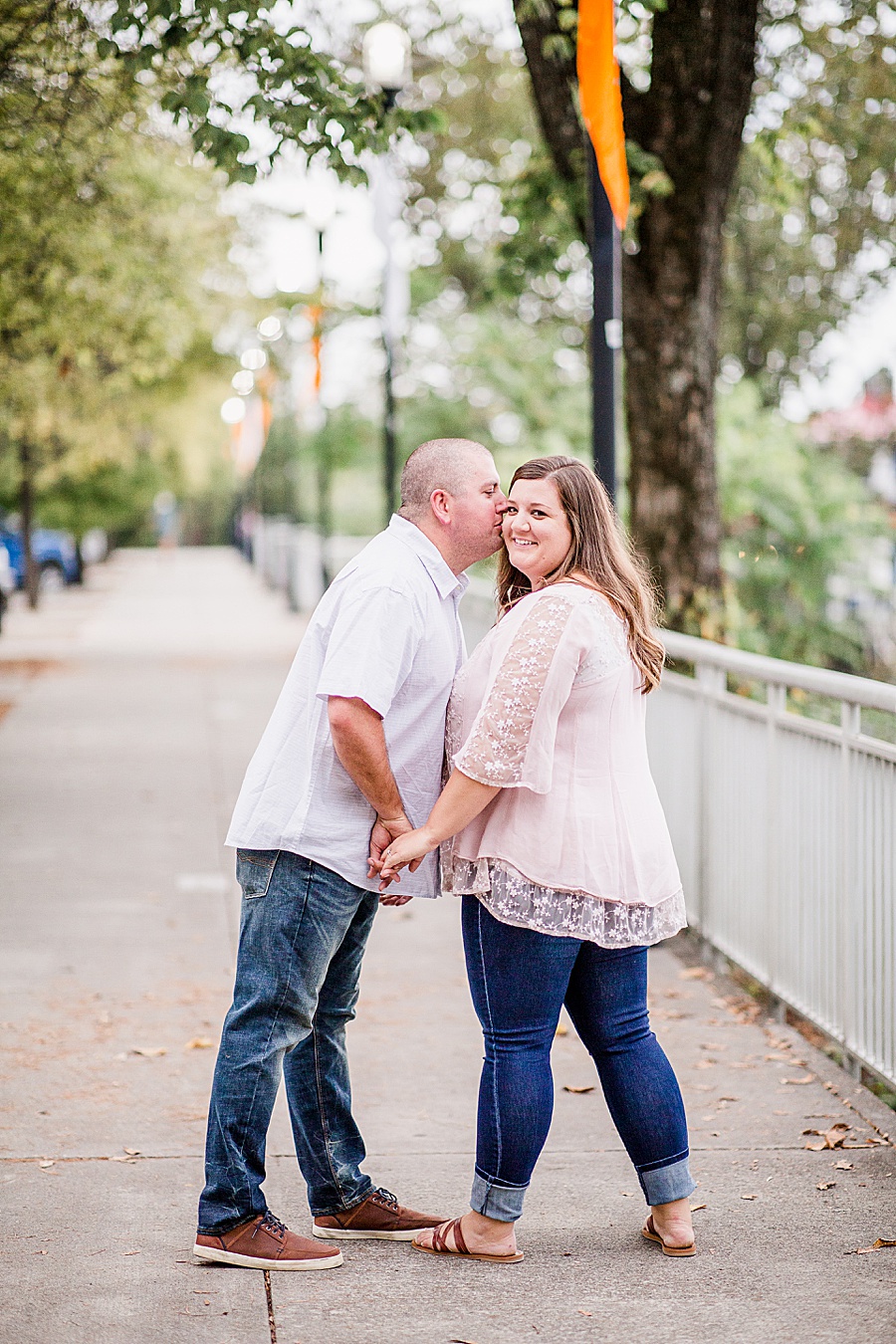 Kiss on the cheek at this Volunteer Landing engagement session by Knoxville Wedding Photographer, Amanda May Photos.