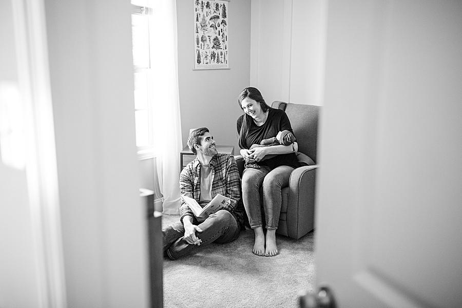 black and white photo of new family in nursery at knoxville newborn session