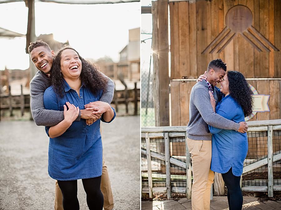 Hug from behind at this Knoxville Zoo engagement by Knoxville Wedding Photographer, Amanda May Photos.