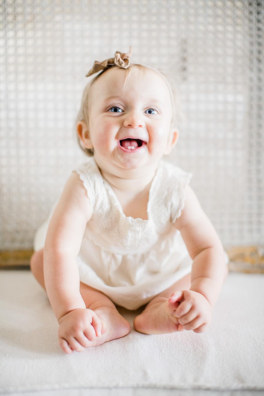 Smiling baby at this 12 month lifestyle session by Knoxville Wedding Photographer, Amanda May Photos.