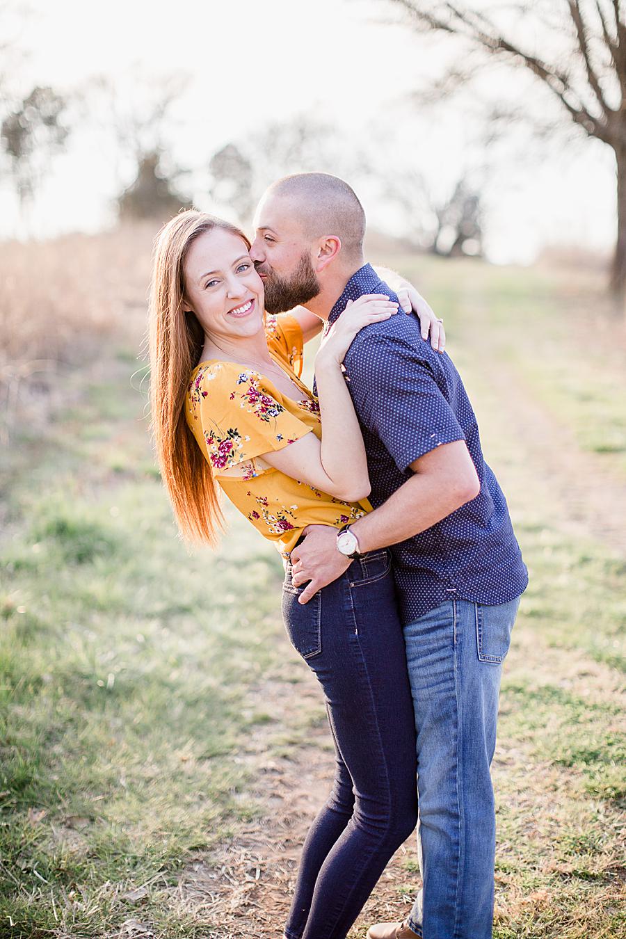 Kiss on the cheek at this Marblegate Farm engagement by Knoxville Wedding Photographer, Amanda May Photos.