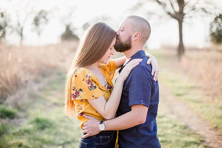 Forehead kiss at this Marblegate Farm engagement by Knoxville Wedding Photographer, Amanda May Photos.