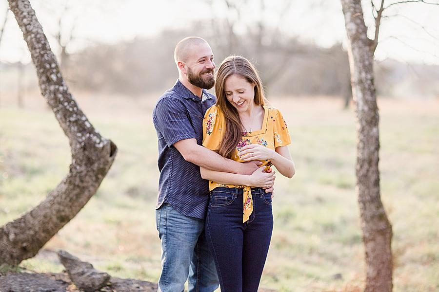 Hug from behind at this Marblegate Farm engagement by Knoxville Wedding Photographer, Amanda May Photos.