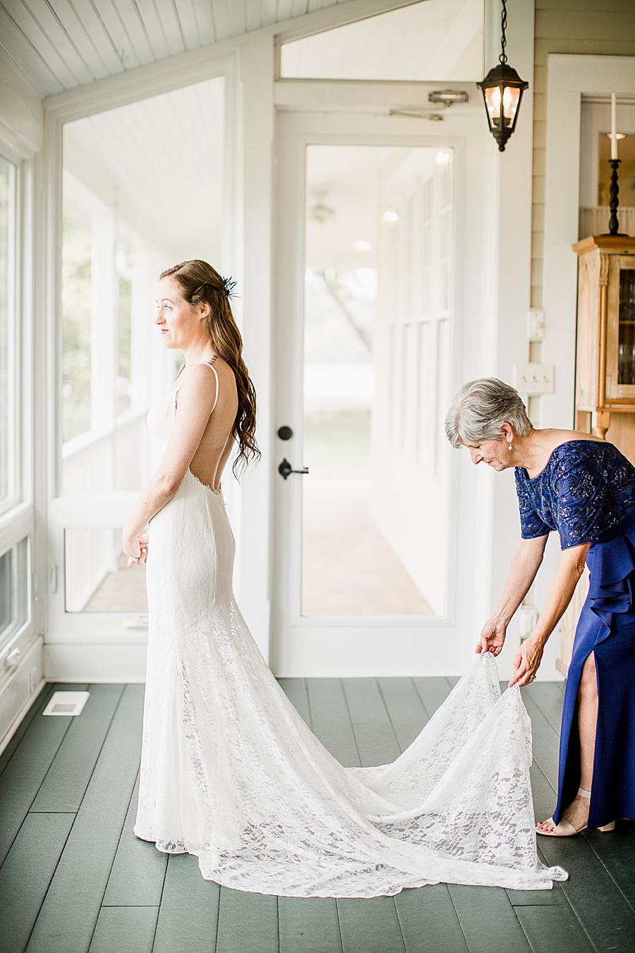 Fluffing the dress at this Marblegate Farm Wedding by Knoxville Wedding Photographer, Amanda May Photos.