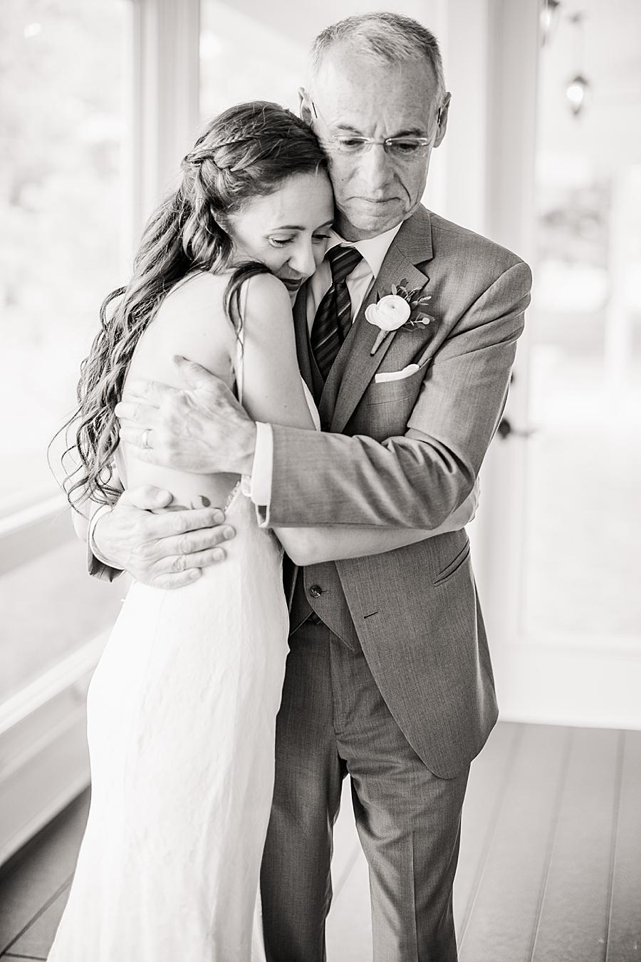 Hugging dad at this Marblegate Farm Wedding by Knoxville Wedding Photographer, Amanda May Photos.