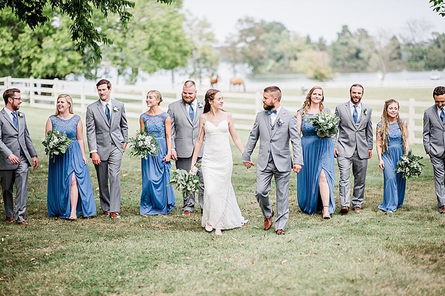 Holding hands and walking at this Marblegate Farm Wedding by Knoxville Wedding Photographer, Amanda May Photos.