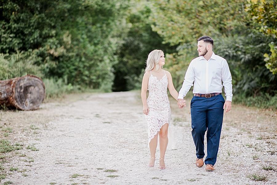 Walking hand in hand at this Meads Quarry engagement by Knoxville Wedding Photographer, Amanda May Photos.