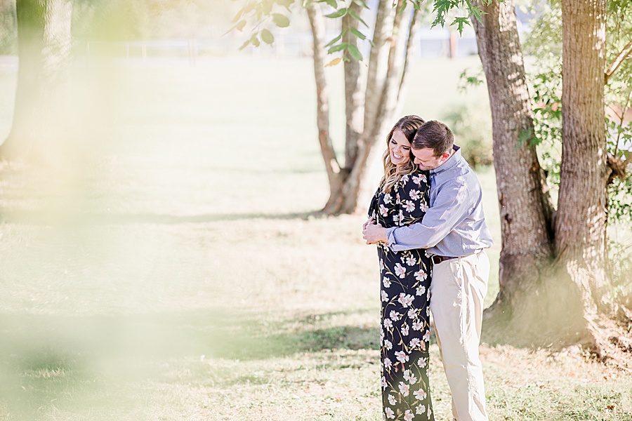 Hug from behind at this Melton Hill engagement session by Knoxville Wedding Photographer, Amanda May Photos.