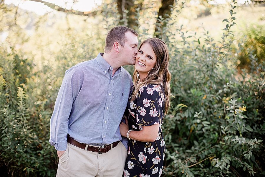 Cheek kiss at this Melton Hill engagement session by Knoxville Wedding Photographer, Amanda May Photos.